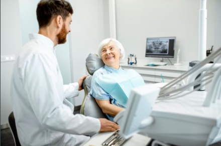 Older adult woman with dentist